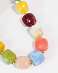 Colorful beaded necklace on a white background