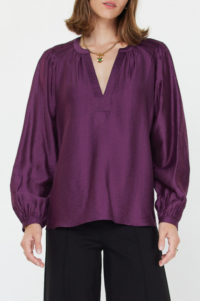 Purple long sleeve silky blouse with a v-neck collar