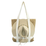 Woven tote bag with a straw hat on a light blue background