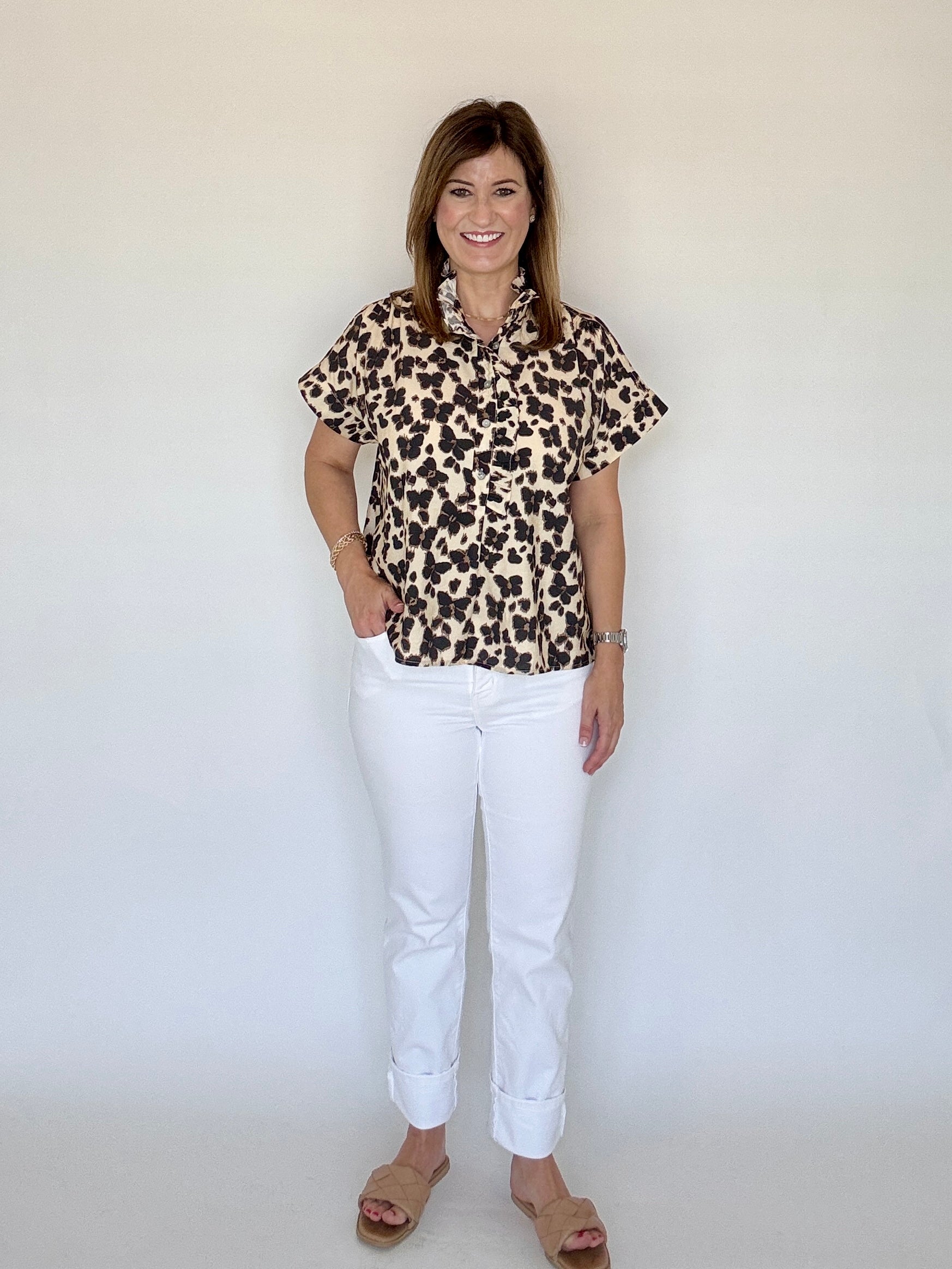 Front view of the Cheetah Print Blouse, showing the ruffle collar and button front, from Chatsworth Boutique.