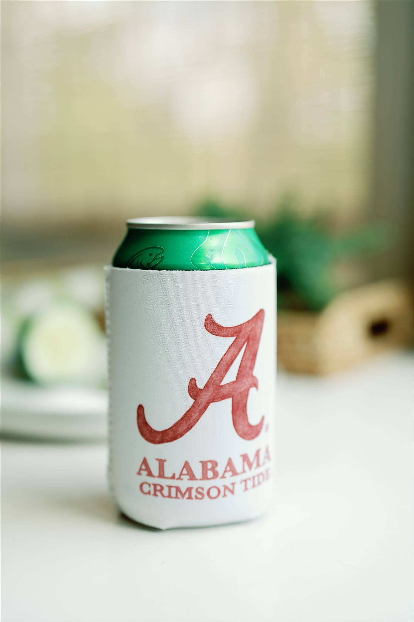 Can cooler with Alabama Crimson Tide logo on a blurred background