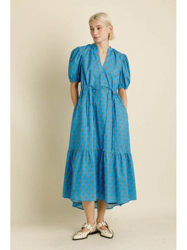 woman wearing a long blue full length dress