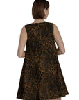 Woman wearing a leopard print dress against a plain background