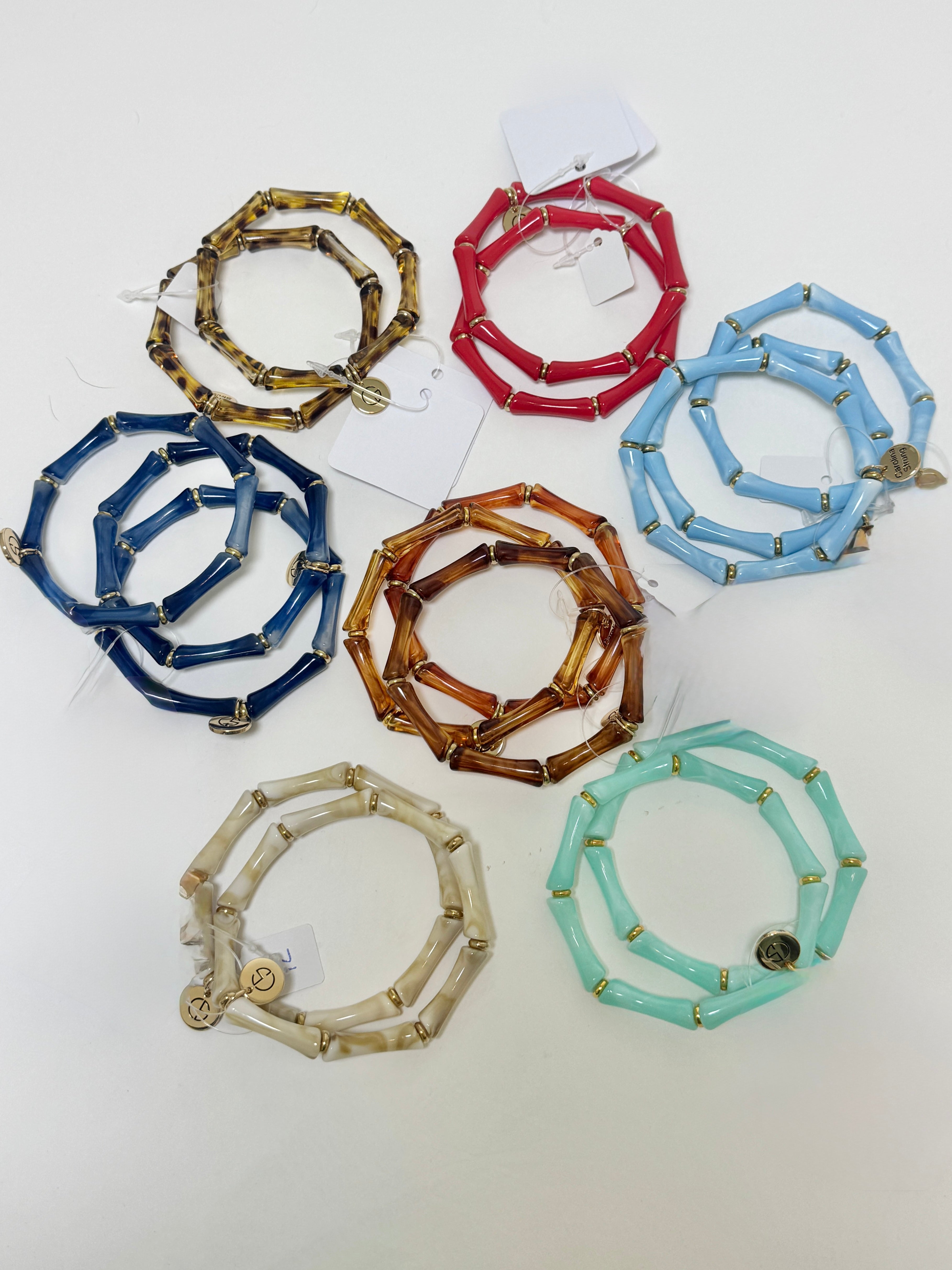 Set of colorful bracelets on a white background