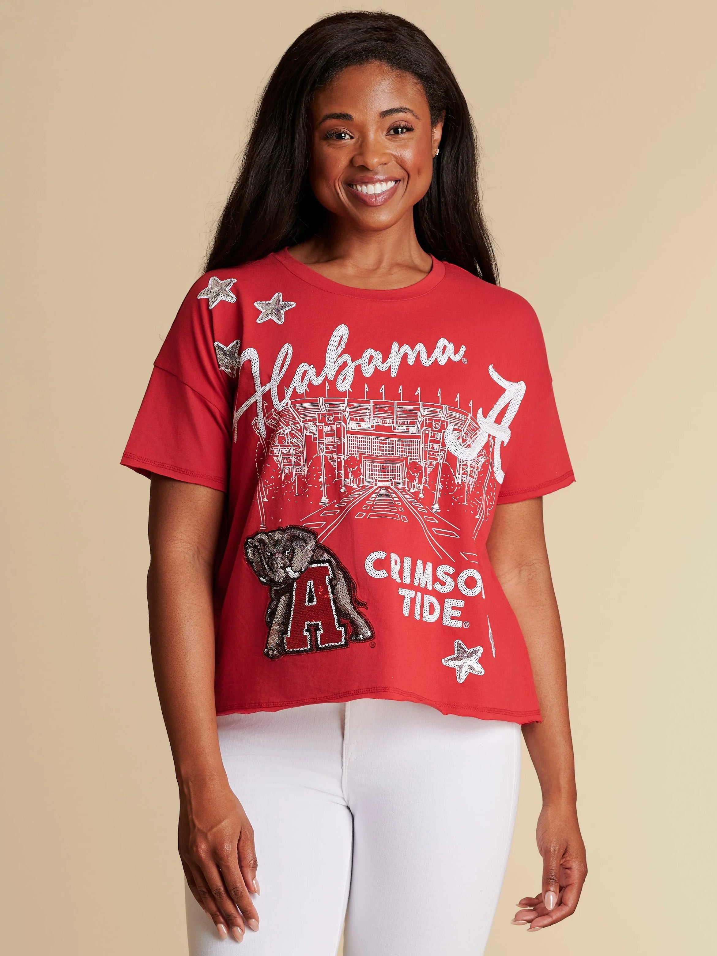A red boxy fit womens tee for Alabama Crimson Tide with Big Al logo on a silhouette of Bryant-Denny Stadium.