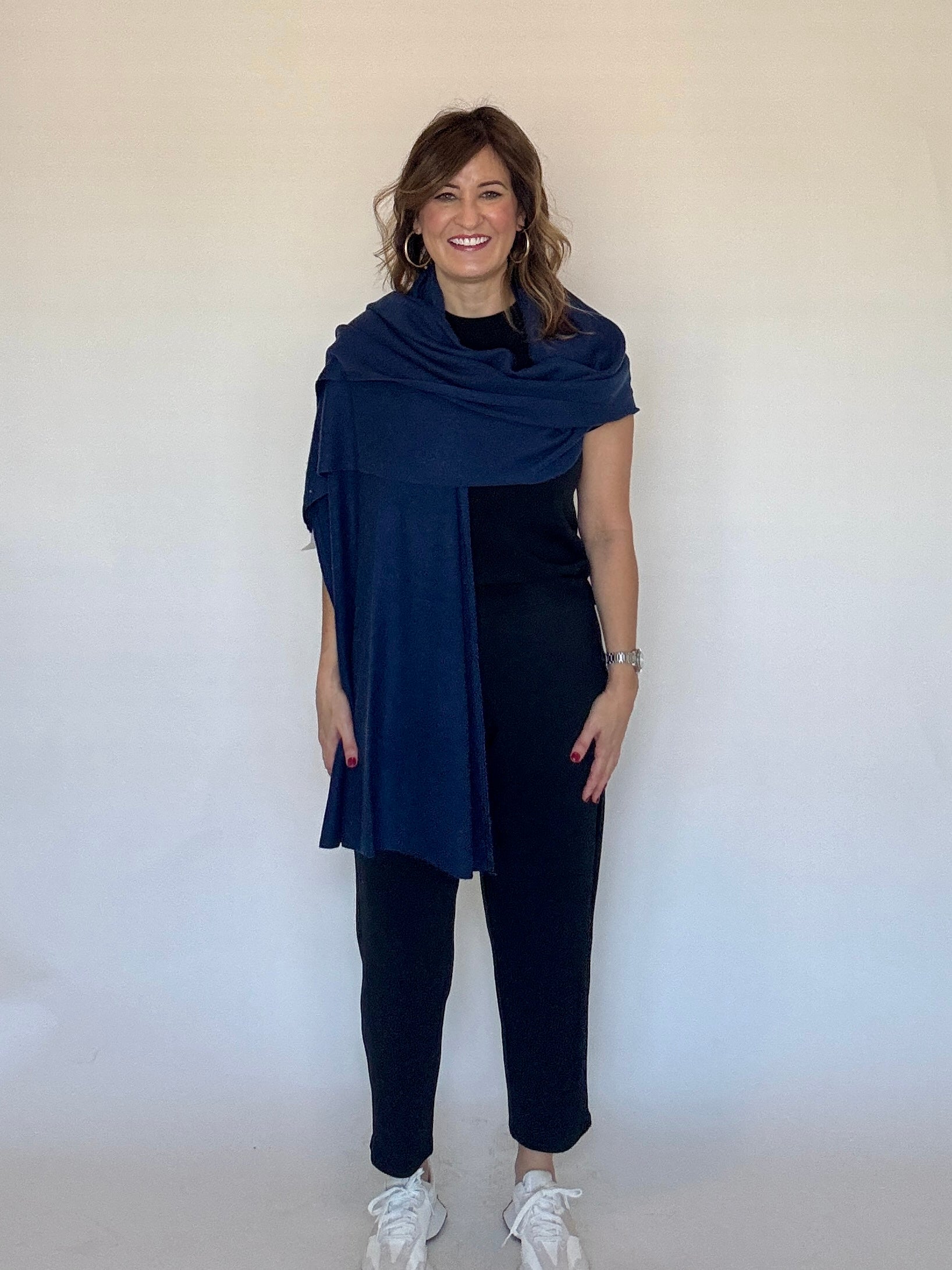 100% cashmere wrap in navy worn as a shawl - Chatsworth Boutique