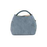 Blue denim handbag on a white background