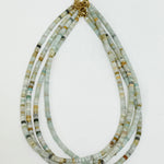 Necklace with multicolored beads on a white background