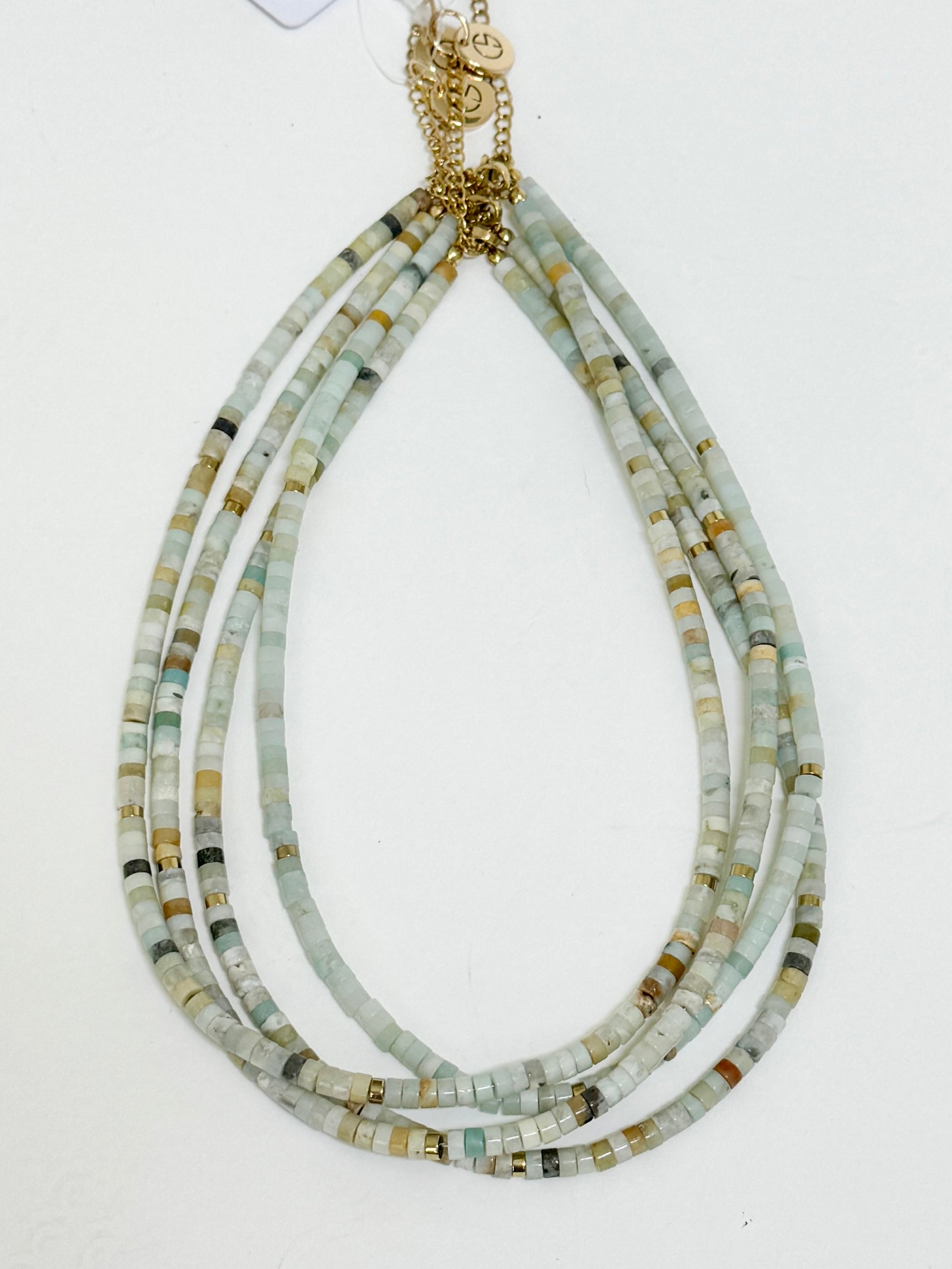Necklace with multicolored beads on a white background