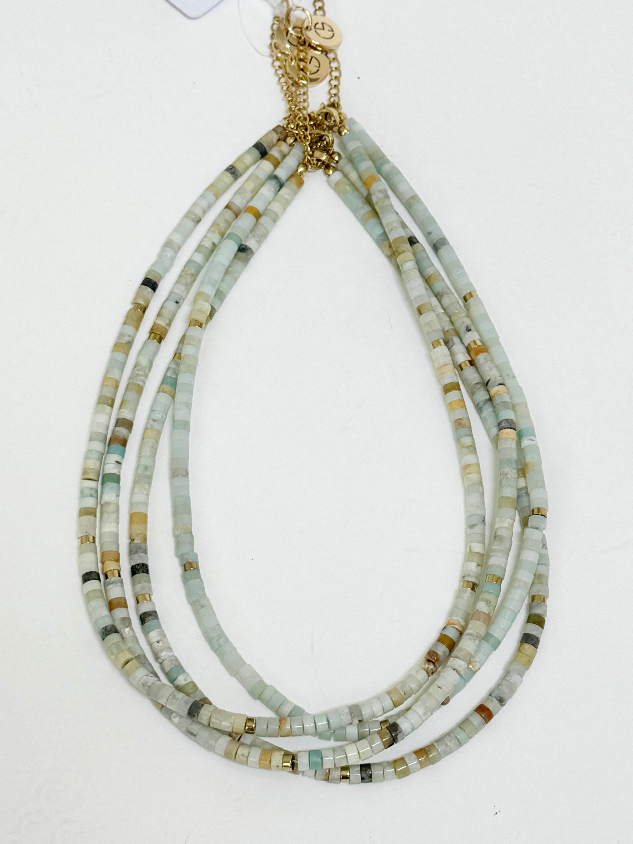 Necklace with multicolored beads on a white background