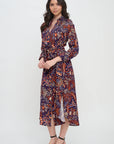 Woman wearing a patterned dress on a white background