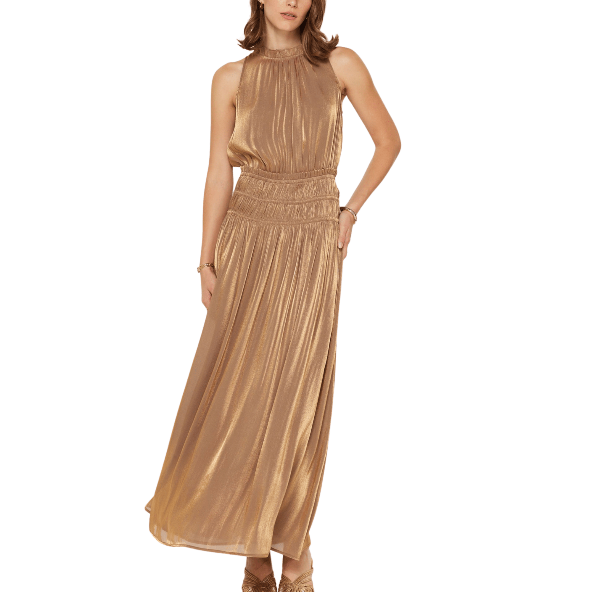 A woman wearing a shimmery gold halter neck maxi dress.