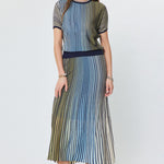 Woman wearing a striped dress on a white background