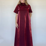 Red Satin Maxi Dress by Entro with mock neck and short sleeves, styled with black pumps