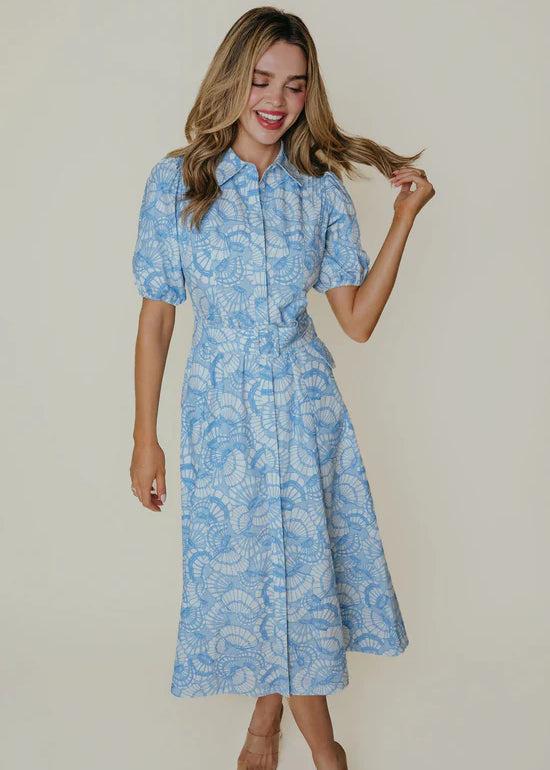 A blue and white collared midi shirtdress with a belt.
