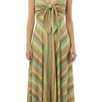 A woman wearing a lime green orange and blue stripe spaghetti strap dress with a bow at the bust.