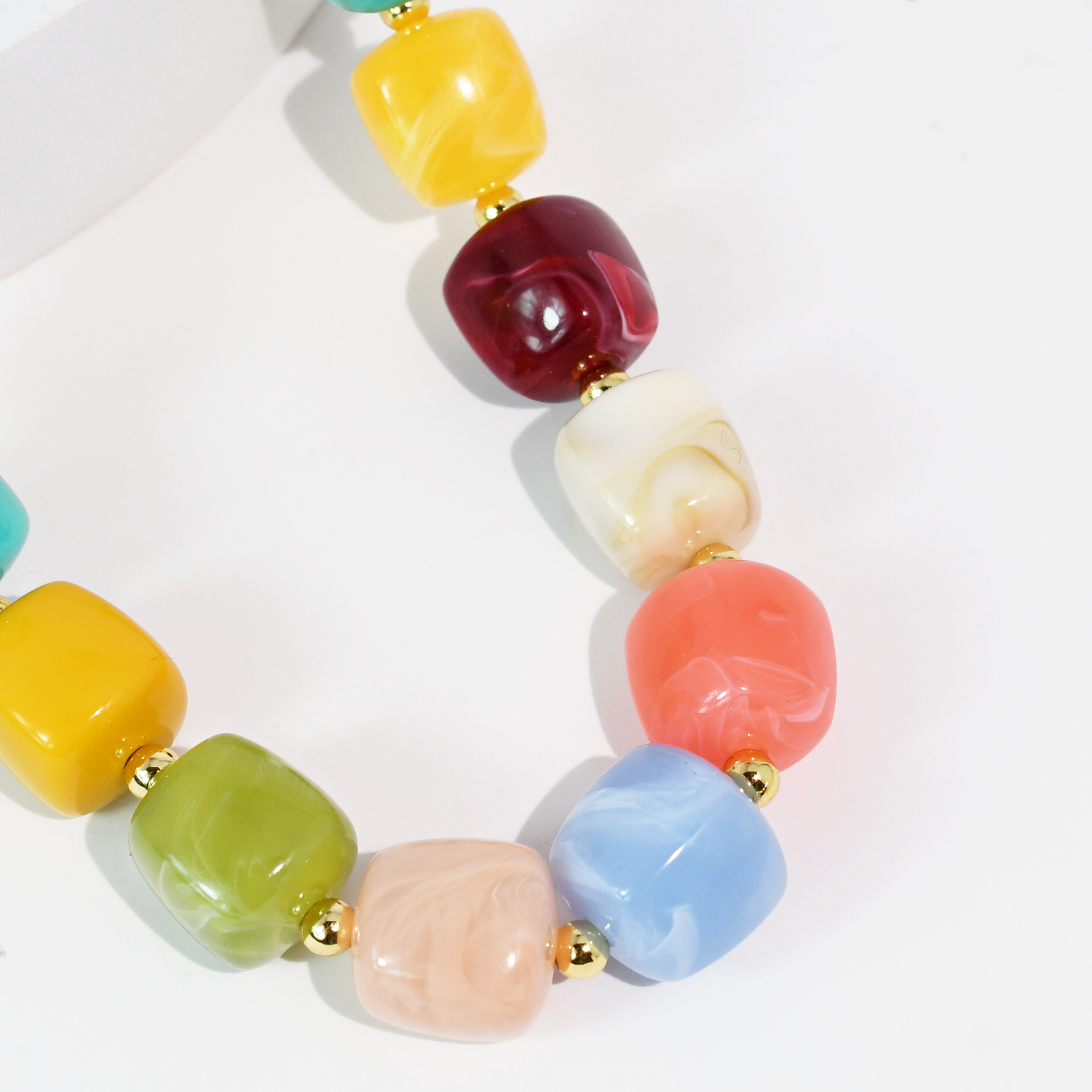 Colorful beaded necklace on a white background
