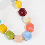 Colorful beaded necklace on a white background