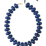 Blue beaded necklace on a white background