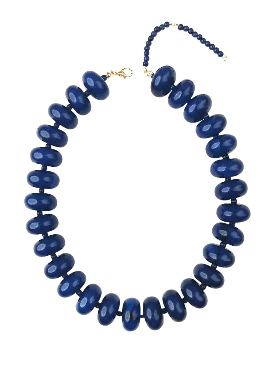 Blue beaded necklace on a white background