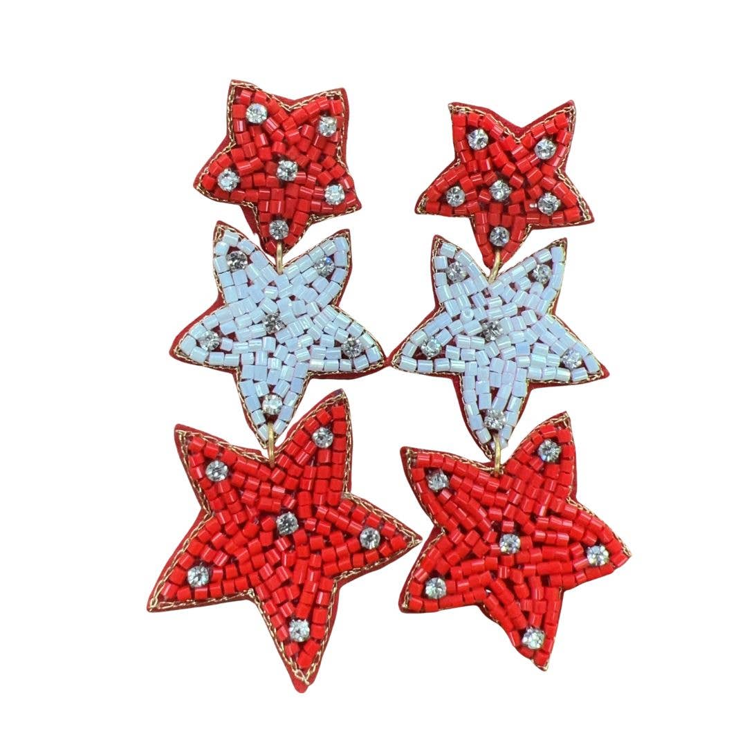 Star-shaped earrings in red & white on a white background