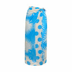 A blue and white palm frond sarong with blue dot border.