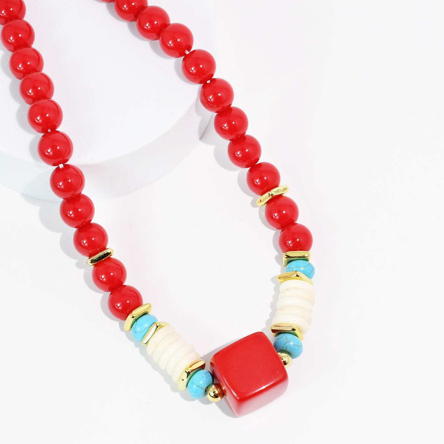 Necklace with red, white, and blue beads on a white background