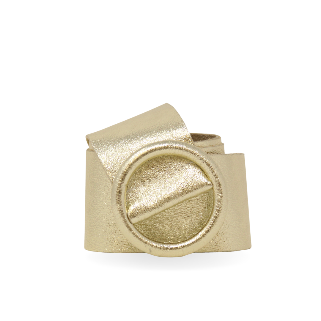 Gold-colored metal component on a white background