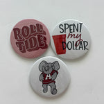 Alabama game day pin-back button set featuring Roll Tide, Spent My Dollar, and Elephant Mascot designs, from Chatsworth Boutique in Fairhope, Alabama.