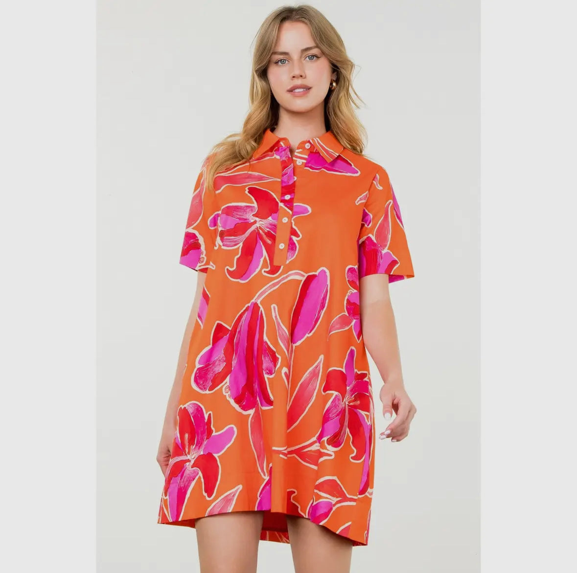 woman wearing an orange and hot pink loose tunic