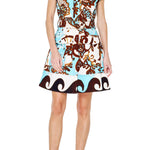 A model wearing the Chocolate/Teal Mini Dress by Ciebon, a belted paisley print A-line dress with structured shoulder tabs and cargo pockets, from Chatsworth Boutique in Fairhope, Alabama.