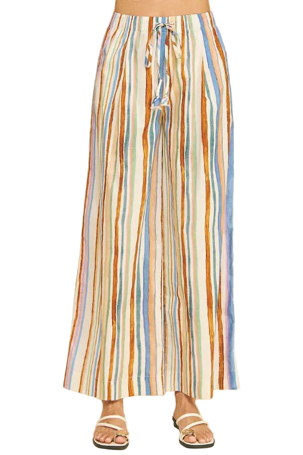 Multicolored striped pants on a beige background