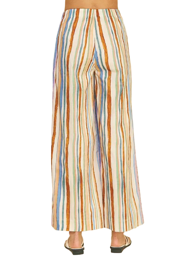 Multicolored striped pants on a beige background