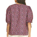 Another view of the Geometric Print Puff Sleeve Blouse in navy and pink by PINCH, from Chatsworth Boutique in Fairhope, Alabama.
