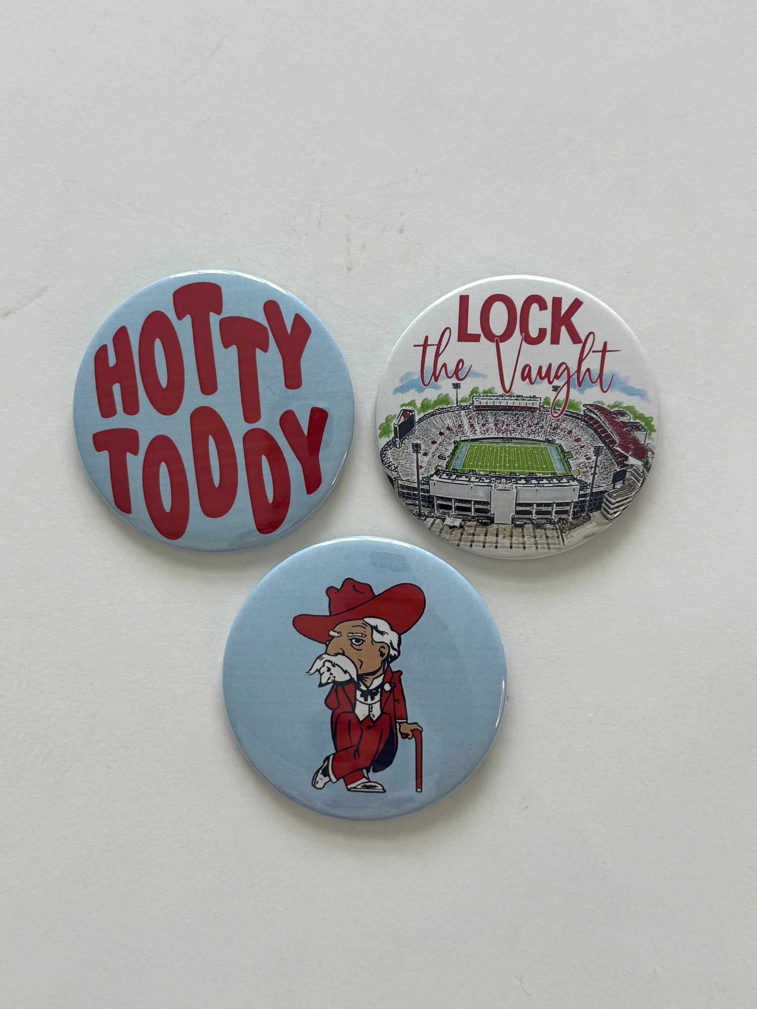 Ole Miss game day pin-back button set featuring Hotty Toddy, Lock the Vaught, and Colonel Reb designs, from Chatsworth Boutique in Fairhope, Alabama.