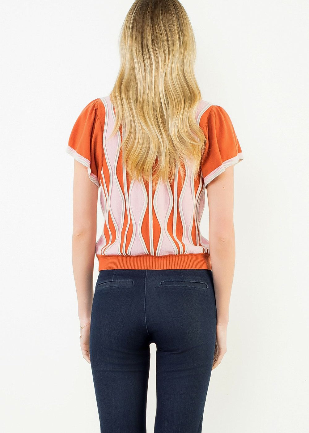 Front view of the Orange Ruffle Knit Blouse by THML, showing the ruffle detail and wavy print, from Chatsworth Boutique.