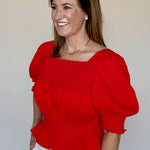 Back view of the Ruby Top in red by LaRoque, from Chatsworth Boutique in Fairhope, Alabama.