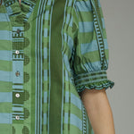 Back view of the Stripes and Dots Blouse in green by Entro, from Chatsworth Boutique in Fairhope, Alabama.