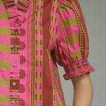 Back view of the Stripes and Dots Blouse in pink and chartreuse by Entro, from Chatsworth Boutique in Fairhope, Alabama.